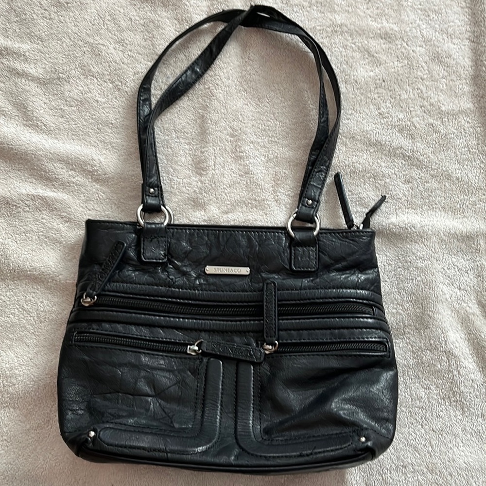 Black Stone & Co tote with lots of exterior pockets.